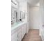 Stylish bathroom featuring a glass vessel sink on a white vanity and a separate tub area at 6712 W Northview Ave, Glendale, AZ 85303