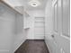 Organized walk-in closet featuring built-in shelves and hanging rods for optimal storage solutions at 6712 W Northview Ave, Glendale, AZ 85303