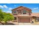 Charming two-story home featuring a tile roof, two-car garage, and well-maintained landscaping under a bright, sunny sky at 6712 W Northview Ave, Glendale, AZ 85303