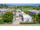 Stunning aerial view of a home with a red door next to a golf course at 7878 E Gainey Ranch Rd # 36, Scottsdale, AZ 85258