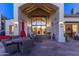 Spacious back patio featuring stylish outdoor furniture and a grand arched entrance at 7878 E Gainey Ranch Rd # 36, Scottsdale, AZ 85258