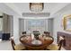 Charming dining room featuring a round table set for six under an elegant chandelier at 7878 E Gainey Ranch Rd # 36, Scottsdale, AZ 85258