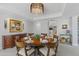 Elegant dining room featuring a round table, chandelier, and seamless flow to the kitchen at 7878 E Gainey Ranch Rd # 36, Scottsdale, AZ 85258