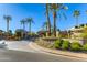 Community entrance featuring stone accents, desert landscaping, and a clear view of the neighborhood's name at 7878 E Gainey Ranch Rd # 36, Scottsdale, AZ 85258
