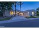 Elegant home exterior featuring a well-maintained lawn, mature trees, and a spacious driveway at 7878 E Gainey Ranch Rd # 36, Scottsdale, AZ 85258