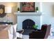 Living room with an elegant fireplace and stylish decor with comfortable seating at 7878 E Gainey Ranch Rd # 36, Scottsdale, AZ 85258