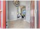 Elegant foyer with tile flooring, soaring ceilings, and a glimpse of the living room at 7878 E Gainey Ranch Rd # 36, Scottsdale, AZ 85258