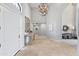 Elegant foyer with tiled flooring, high ceiling, and designer chandelier at 7878 E Gainey Ranch Rd # 36, Scottsdale, AZ 85258
