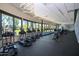 Well-equipped gym with ellipticals and treadmills near large windows overlooking the lawns at 7878 E Gainey Ranch Rd # 36, Scottsdale, AZ 85258