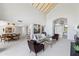 Spacious living room showcasing high ceilings and an open floor plan to the dining area at 7878 E Gainey Ranch Rd # 36, Scottsdale, AZ 85258