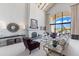 Spacious living room features vaulted ceilings, fireplace, large arched window, and comfortable seating at 7878 E Gainey Ranch Rd # 36, Scottsdale, AZ 85258