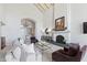 Bright living area boasting high ceilings, fireplace, and seamless flow to the entryway at 7878 E Gainey Ranch Rd # 36, Scottsdale, AZ 85258