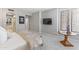 Bedroom featuring a tv, decorative side table, and plantation shutters on the window at 7878 E Gainey Ranch Rd # 36, Scottsdale, AZ 85258