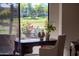 Bright office space overlooking a garden with built-in desk, ample lighting, and comfortable seating at 7878 E Gainey Ranch Rd # 36, Scottsdale, AZ 85258