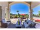 Outdoor living space featuring a firepit, patio furniture, and views of the golf course at 7878 E Gainey Ranch Rd # 36, Scottsdale, AZ 85258