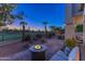 Cozy outdoor patio with a fire pit and plush seating, perfect for enjoying evenings outdoors at 7878 E Gainey Ranch Rd # 36, Scottsdale, AZ 85258