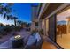 Relaxing outdoor patio featuring comfortable seating, a fire pit, and peaceful surroundings at 7878 E Gainey Ranch Rd # 36, Scottsdale, AZ 85258