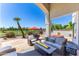 Inviting outdoor patio with a fire pit, comfortable seating, and scenic golf course views at 7878 E Gainey Ranch Rd # 36, Scottsdale, AZ 85258