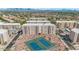 Aerial view of the multi-building condominium complex showcasing amenities, mountain views, and tennis courts at 7960 E Camelback Rd # 409, Scottsdale, AZ 85251