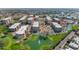 Aerial view of community, highlighting its lush landscaping, multiple pools, and various amenities at 7960 E Camelback Rd # 409, Scottsdale, AZ 85251