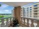 Open balcony with views of the building and sports field, decorated with hanging plants and other botanicals at 7960 E Camelback Rd # 409, Scottsdale, AZ 85251