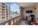 Balcony view showcasing the surrounding buildings and the mountains from comfortable seating and a grilling area at 7960 E Camelback Rd # 409, Scottsdale, AZ 85251