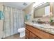 This bathroom features tile flooring, a granite countertop, a shower, and modern fixtures at 7960 E Camelback Rd # 409, Scottsdale, AZ 85251