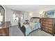 This bedroom has carpeted floors, ample natural light, and a full furniture set at 7960 E Camelback Rd # 409, Scottsdale, AZ 85251
