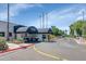 Community entrance featuring a guardhouse, golf carts, and well-maintained landscaping at 7960 E Camelback Rd # 409, Scottsdale, AZ 85251