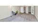 This living room features neutral carpet and paint, plus access to the bathroom and walk-in closet at 7960 E Camelback Rd # 409, Scottsdale, AZ 85251