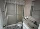 Functional bathroom featuring a shower, toilet, and vanity sink, ready for updates or simple use at 8063 N 31St Ln, Phoenix, AZ 85051