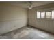 Spacious bedroom with ceiling fan, ready for personalization and flooring at 8063 N 31St Ln, Phoenix, AZ 85051