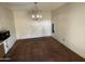 Dining space with tile flooring, neutral walls, and a chandelier, ready for your personal touch at 8063 N 31St Ln, Phoenix, AZ 85051