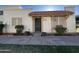 Charming single-story home featuring a tiled roof overhang and tidy landscaping at the front entrance at 8063 N 31St Ln, Phoenix, AZ 85051