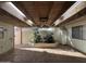 Covered patio featuring unique wooden beamed ceiling with skylights and a decorative fountain at 8063 N 31St Ln, Phoenix, AZ 85051