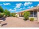Spacious backyard featuring low-maintenance landscaping, patio with table and chairs, and desert plants at 8958 W Rosemonte Dr, Peoria, AZ 85382