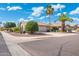 Attractive home on corner lot with desert landscaping featuring a two-car garage and beautiful mature shade trees at 8958 W Rosemonte Dr, Peoria, AZ 85382