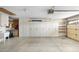 Garage featuring storage cabinets, sink, and tool storage solutions for organization at 8958 W Rosemonte Dr, Peoria, AZ 85382