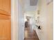 Inviting hallway showcasing neutral wall paint, a closet, and decorative wall shelving at 8958 W Rosemonte Dr, Peoria, AZ 85382