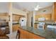 This kitchen offers a functional layout with ample counter space, wood cabinets, and modern appliances at 8958 W Rosemonte Dr, Peoria, AZ 85382