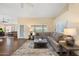 A large sectional sofa and neutral rug complement this inviting living space with lots of natural light at 8958 W Rosemonte Dr, Peoria, AZ 85382
