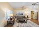 Comfortable living room with neutral walls, hardwood floors, and comfortable seating at 8958 W Rosemonte Dr, Peoria, AZ 85382