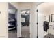 Hallway view with a bedroom, game room and bathroom showcasing the home's layout at 9569 W Redbird Rd, Peoria, AZ 85383