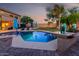 Outdoor pool, manicured yard, and outdoor seating, perfect for relaxation and enjoyment at 9569 W Redbird Rd, Peoria, AZ 85383