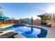 Beautiful pool area featuring umbrellas, and lounge chairs, perfect for outdoor relaxation at 9569 W Redbird Rd, Peoria, AZ 85383