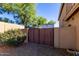 Fenced-in side yard providing secure access with additional landscaping at 9569 W Redbird Rd, Peoria, AZ 85383