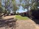 Backyard view with patio, grass, and gravel area at 10190 N 106Th E St, Scottsdale, AZ 85258