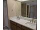 Bathroom featuring a double vanity with modern fixtures, enhancing the functionality at 10190 N 106Th E St, Scottsdale, AZ 85258