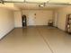 The garage has a sink, water heater, storage shelves, and epoxy floor at 10190 N 106Th E St, Scottsdale, AZ 85258