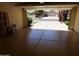 View of the 2-car garage featuring an epoxy floor and open garage door at 10190 N 106Th E St, Scottsdale, AZ 85258